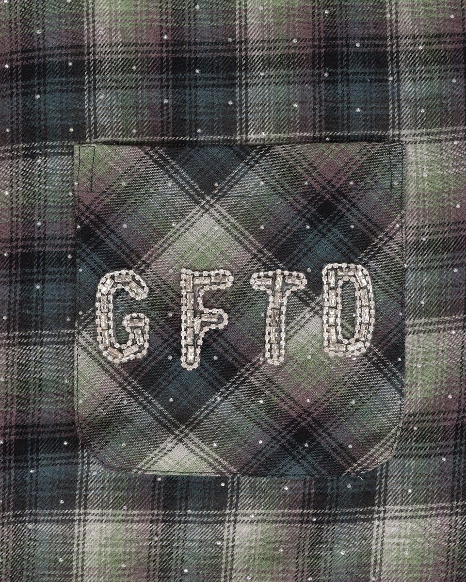 Plaid fabric with 'GFTD' embroidered on a pocket