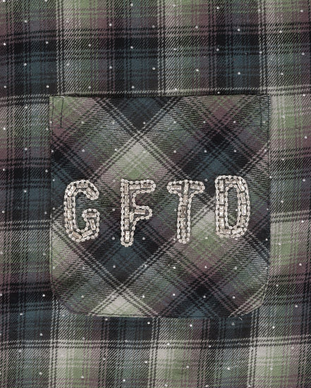 Plaid fabric with 'GFTD' embroidered on a pocket