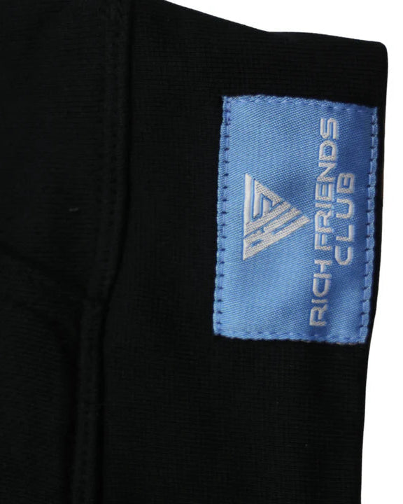 Black garment with a blue label featuring 'Rich Friends Club' text and logo.