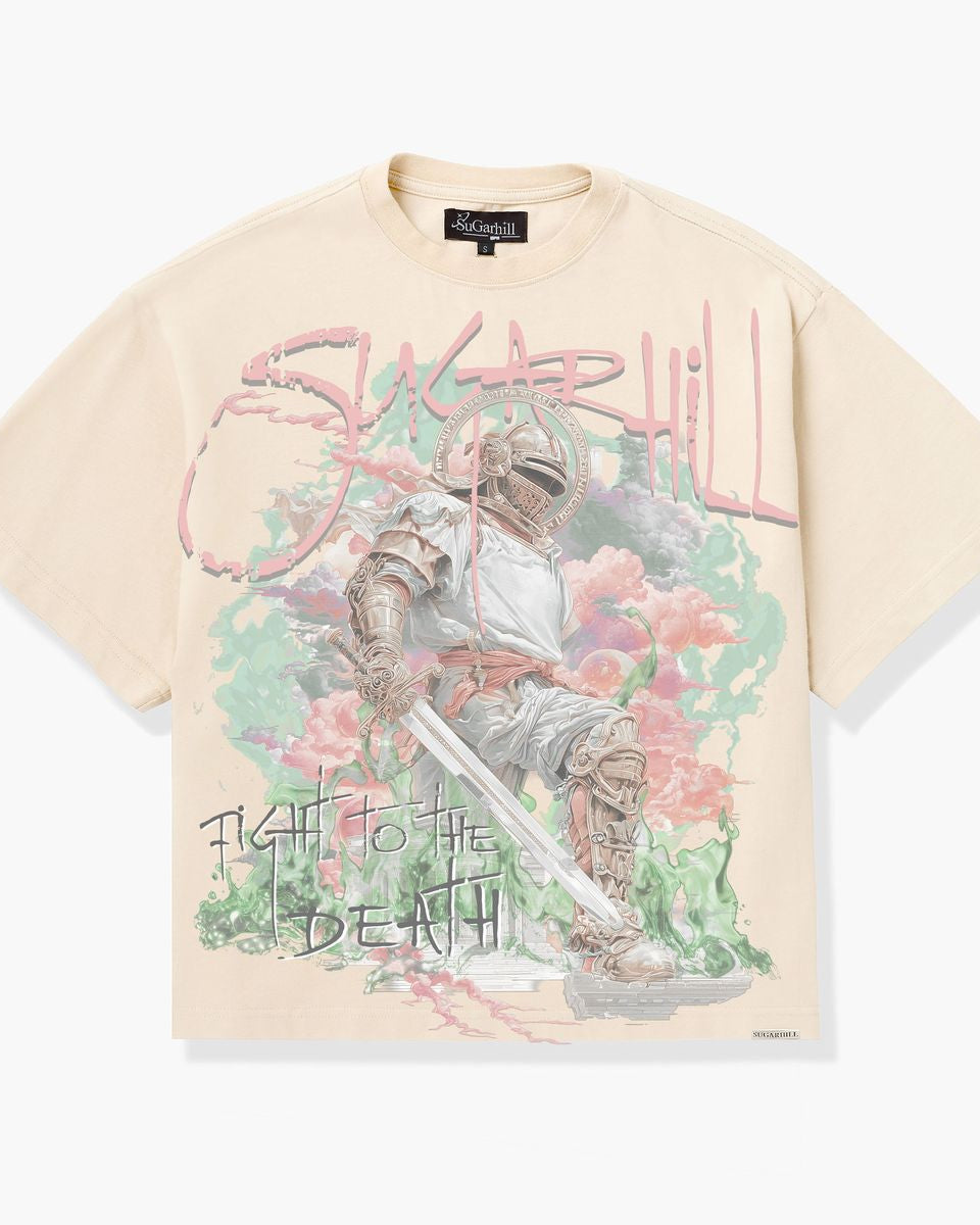 Beige t-shirt with graphic design featuring a character and text on a white background