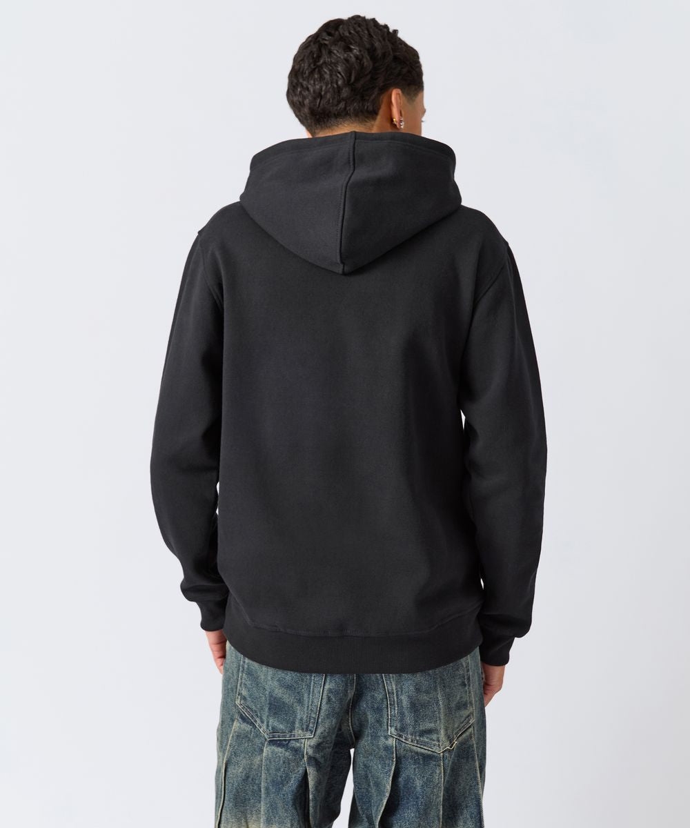 Person wearing a black hoodie from behind on a white background