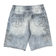 Denim shorts with embroidered designs on a white background