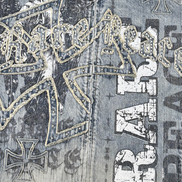 Close-up of a denim jacket with iron cross and 'Rat Fink' branding.