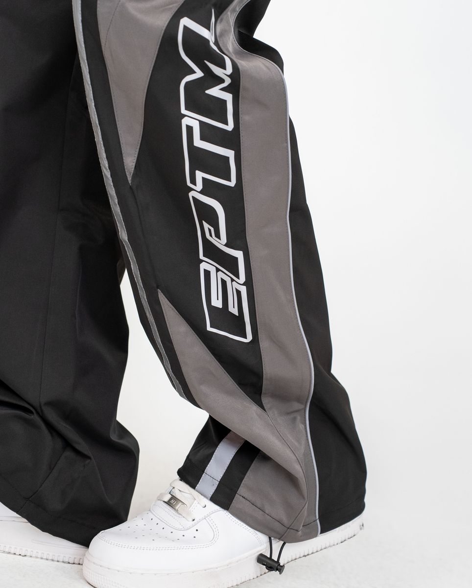 Black and gray tracksuit with 'EPTM' branding on a white background