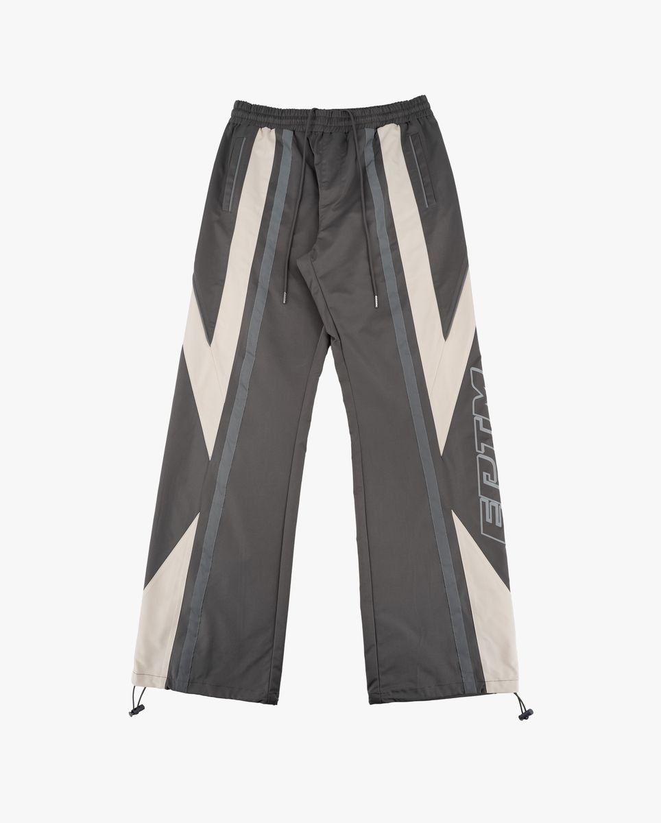Dark gray pants with white and gray geometric patterns on a white background