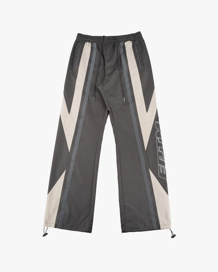 Dark gray pants with white and gray geometric patterns on a white background