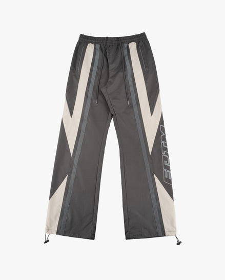 Dark gray pants with white and gray geometric patterns on a white background