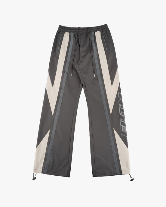 Dark gray pants with white and gray geometric patterns on a white background