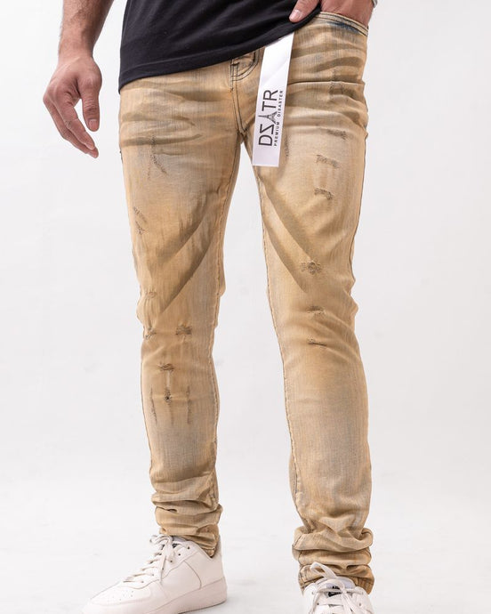 Beige jeans with a brand logo on a white background