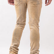 Beige jeans worn by a person on a white background