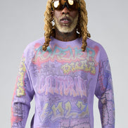 Person wearing a colorful sweater with text and graphics on a gray background