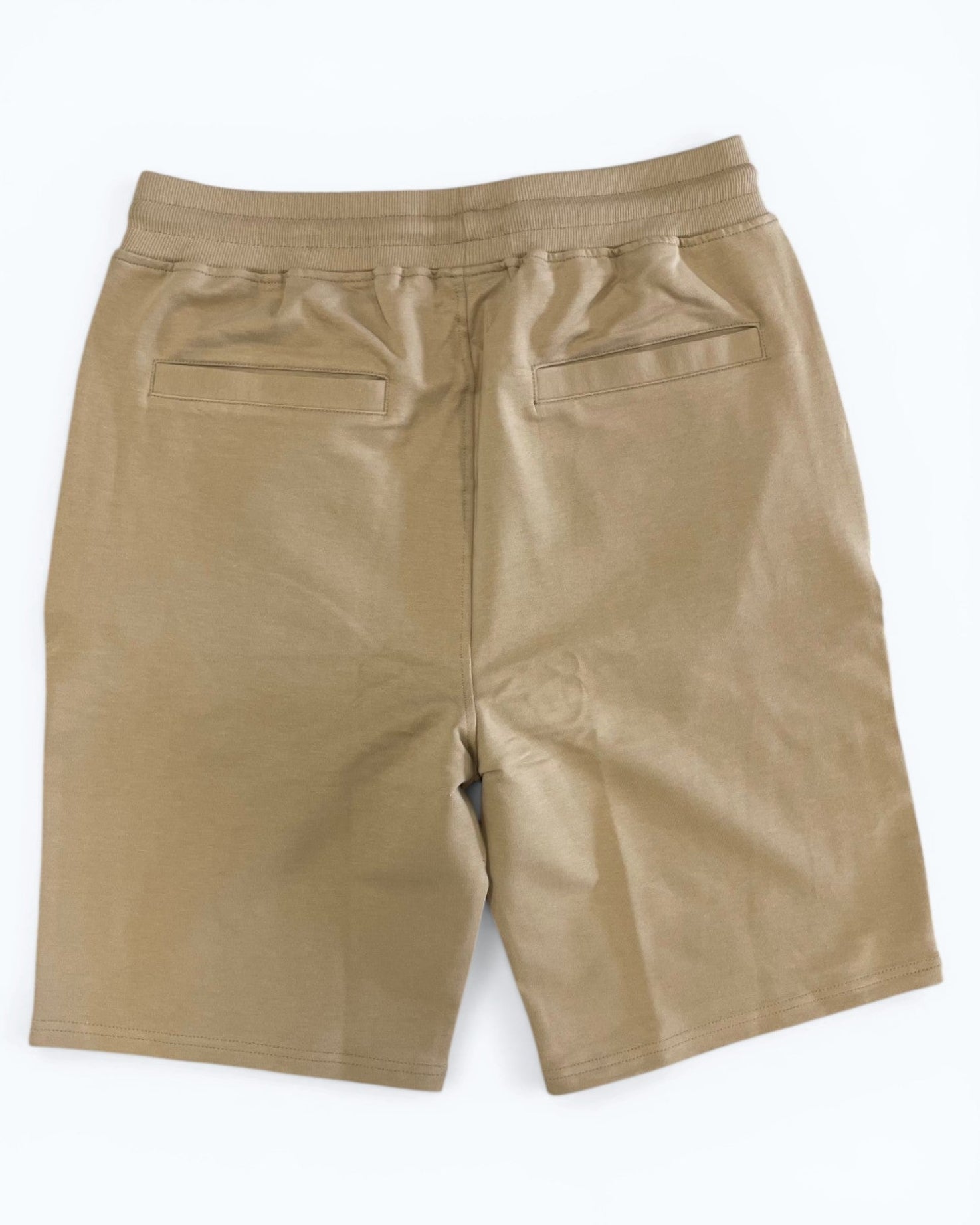 Beige shorts on a white background