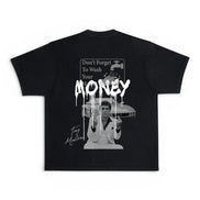A black short-sleeve t-shirt with a large white graphic print on the back. The graphic features a sign that reads 'Don't Forget To Wash Your hands' with a dripping paint effect, says 
