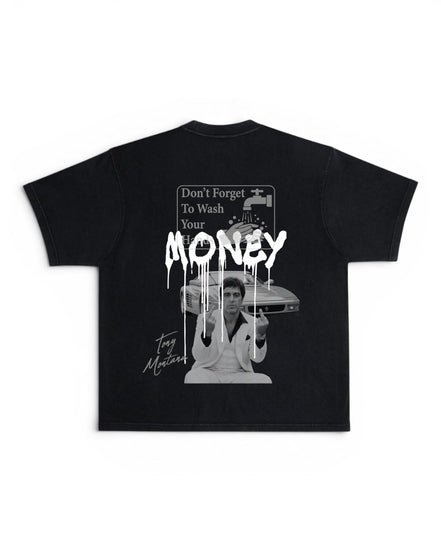 A black short-sleeve t-shirt with a large white graphic print on the back. The graphic features a sign that reads 'Don't Forget To Wash Your hands' with a dripping paint effect, says "MONEY", a black-and-white photo of a man holding a cash register, and a cursive 'Tony Montana' signature.