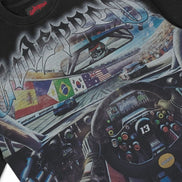 Black t-shirt with a detailed graphic of a race car interior and 'Outlandish' branding.