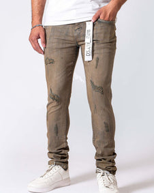 Person wearing distressed gray jeans with a white label on a white background