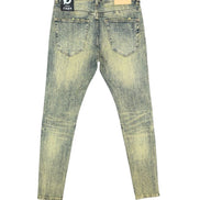 Distressed blue jeans with a brand label on a white background