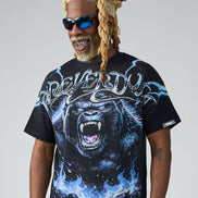 Man wearing a black t-shirt with a gorilla graphic and 'Deliver Us' text on a gray background