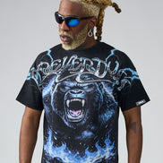 Person wearing a black t-shirt with a graphic design of a gorilla and text on a gray background