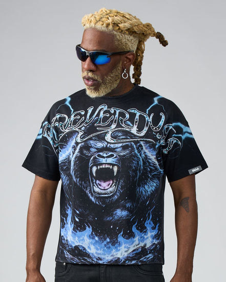 Person wearing a black t-shirt with a graphic design of a gorilla and text on a gray background