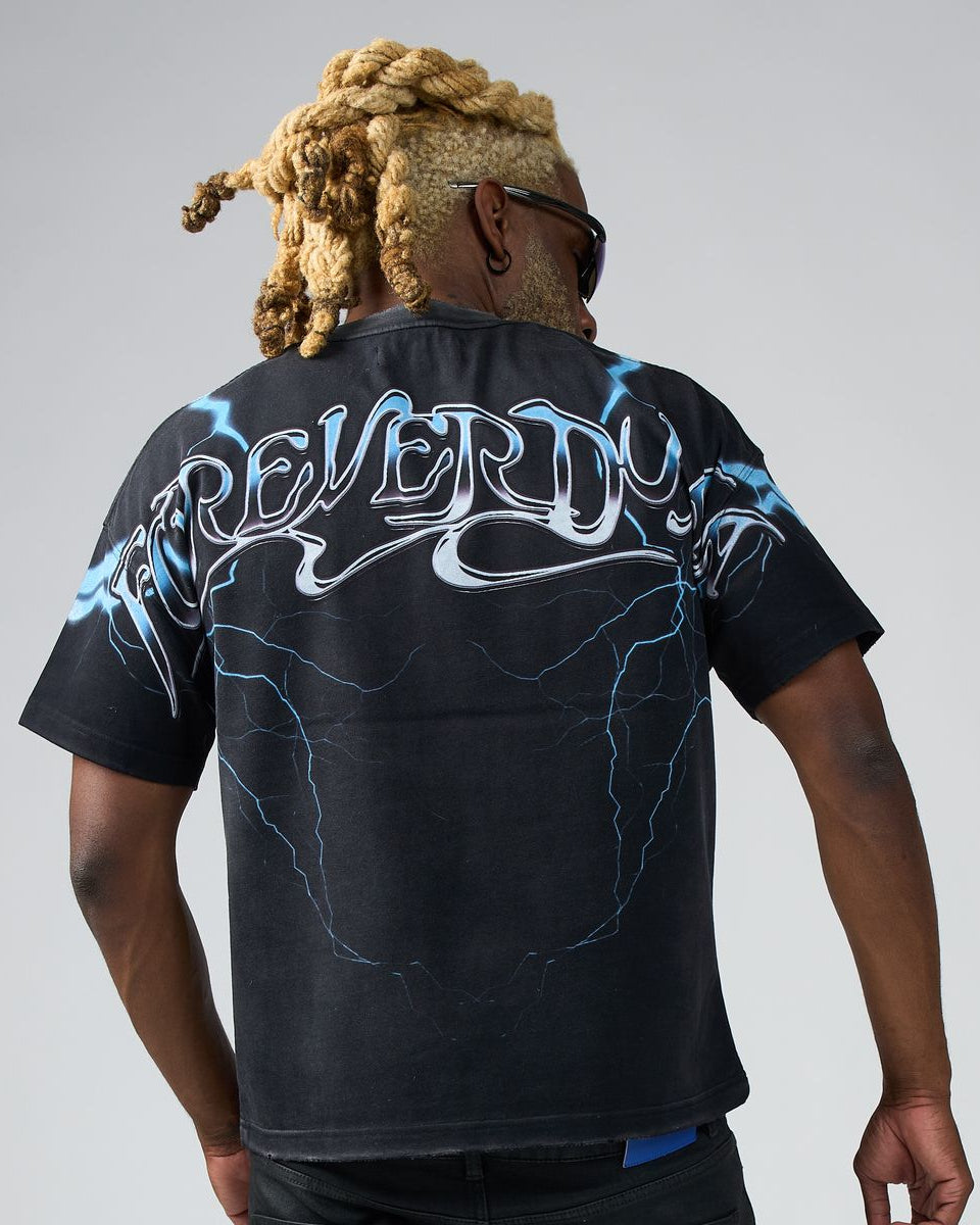 Person wearing a black t-shirt with 'REVERDY' design on the back against a gray background