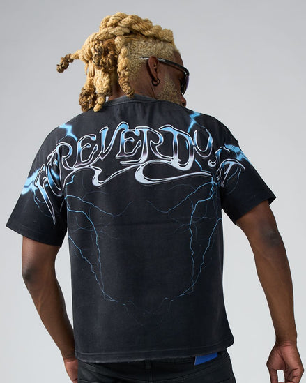 Person wearing a black t-shirt with 'REVERDY' design on the back against a gray background