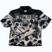 Black and white graphic t-shirt with skeleton design and 'Eternal Dusk' text on a white background