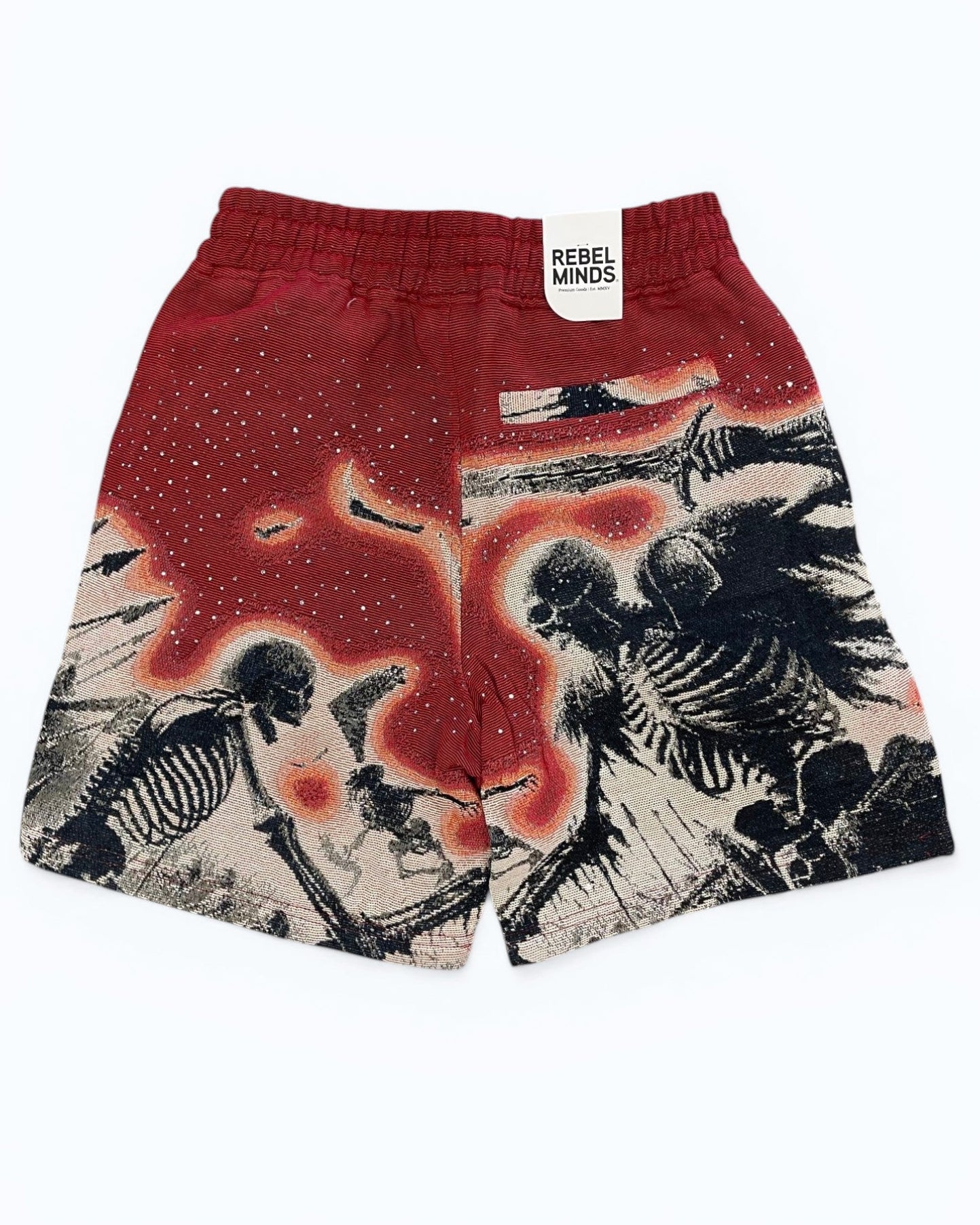 Red shorts with skeleton design and 'Rebel Minds' tag on a white background