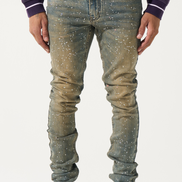 Person wearing a pair of distressed jeans with a white background