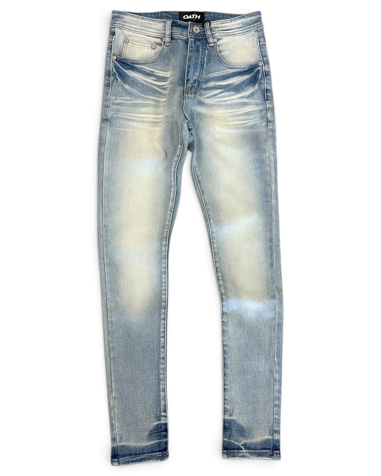 Light blue distressed skinny jeans with a faded yellowish-tan wash on the thighs, shown flat against a white background. The brand name 'GATH' is visible on the black waistband label.