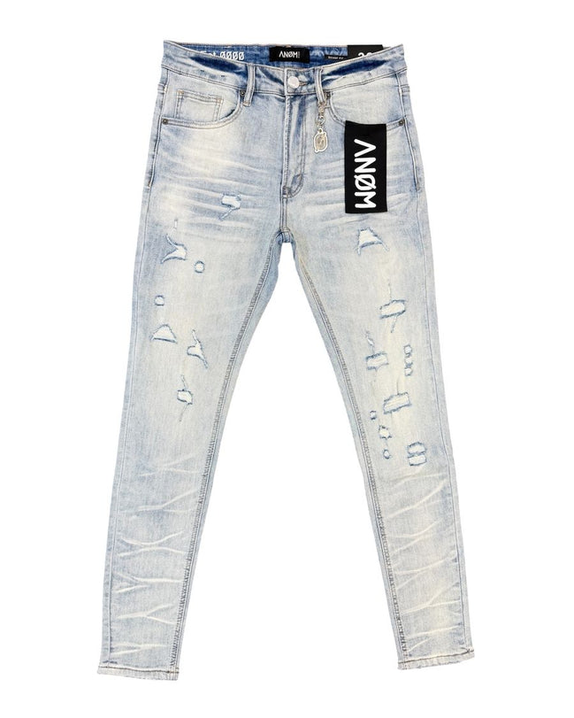 Light wash blue distressed skinny jeans with ripped details and a black brand patch on the pocket, shown flat on a white background.
