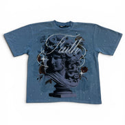 Blue t-shirt with a statue graphic and 'Faith' text on a white background