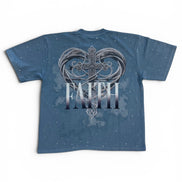Blue t-shirt with a heart and cross design and the word 'FAITH' on a white background