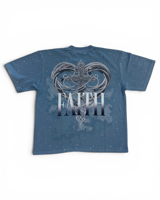 Blue t-shirt with a heart and cross design and the word 'FAITH' on a white background