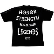 Black t-shirt with white text 'Honor Strength Established Legends 1972' on a white background