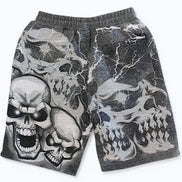 Gray shorts with skull designs on a white background