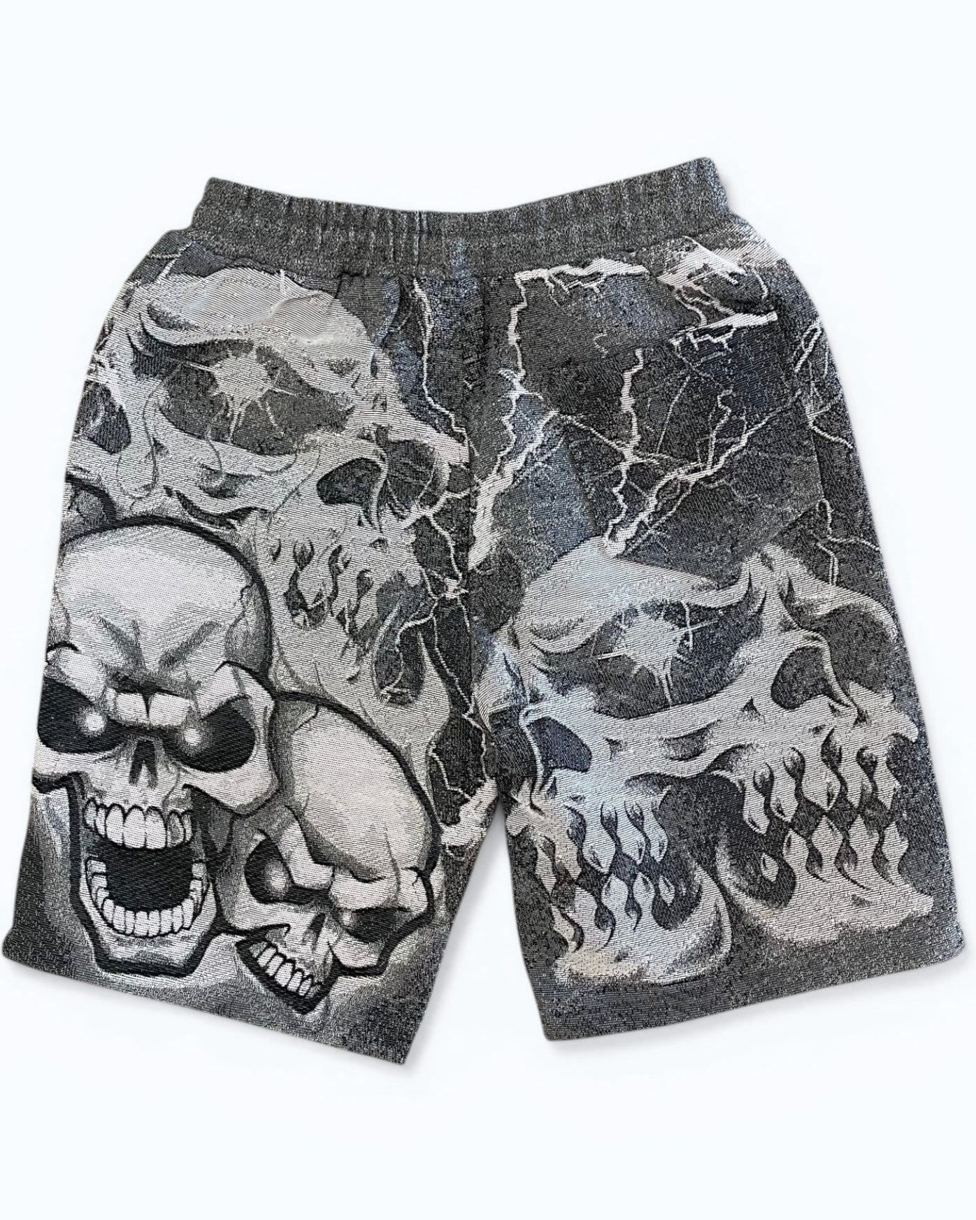 Gray shorts with skull designs on a white background