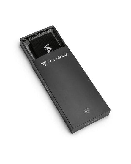 Black rectangular product packaging with 'VALABASAS' branding on a white background