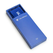 Blue Valerbasas box with a folded blue fabric inside on a white background