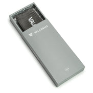 Gray box with a grey item inside, branded 'VALABASAS', on a white background