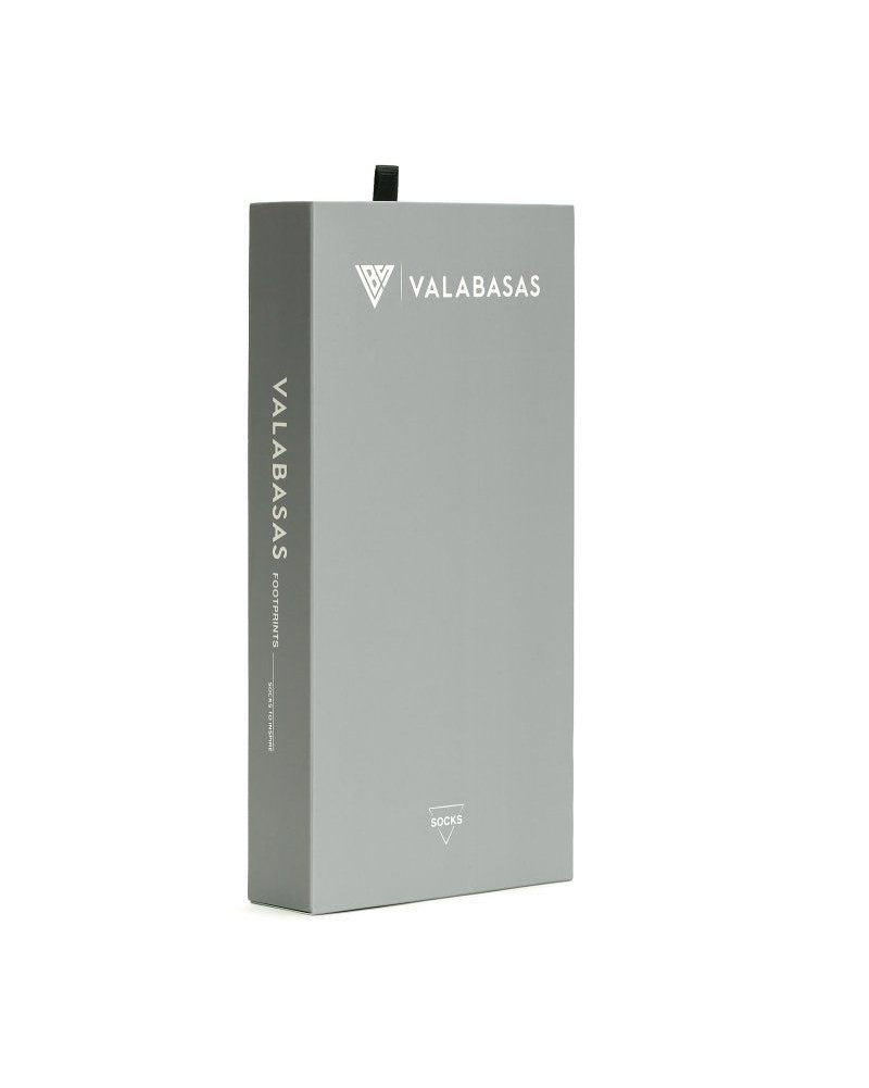 Gray box with 'VALABASAS' branding on a white background
