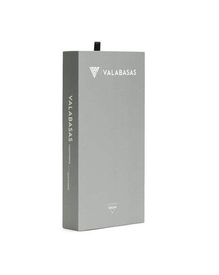 Gray box with 'VALABASAS' branding on a white background