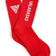 Red socks with white logo and text on a white background