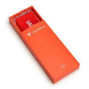 Red sock with 'VALARABAS' branding in an orange box on a white background