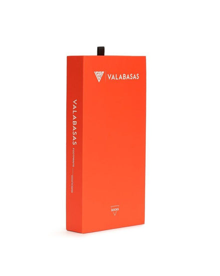 Orange box with 'VALABASAS' branding on a white background