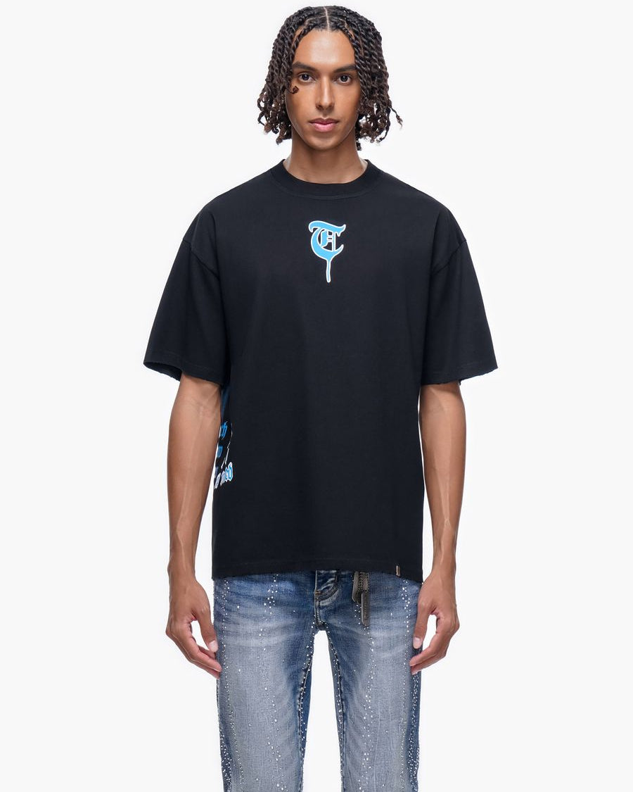 Person wearing a black t-shirt with a blue logo on a white background