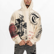 Person wearing a beige hoodie with graphic designs on a white background