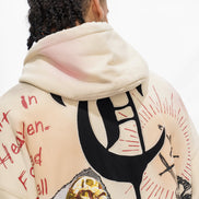 Beige hoodie with graphic designs and text on a white background