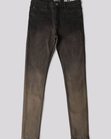 A pair of slim-fit jeans in a washed black or charcoal gray denim, laid flat against a solid light gray background. The brand name '35 LEATHER' is visible on the inner waistband label.