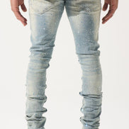 Light blue jeans worn by a person on a white background